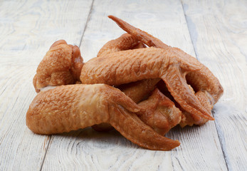 Chicken wings on a wooden background