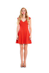 Young beautiful happy blonde woman in red dress