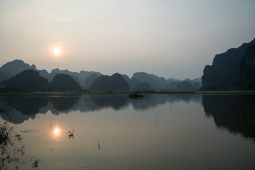 Limestone Landscape with Lake, Sunset and Reflection, Tam Coc, Vietnam