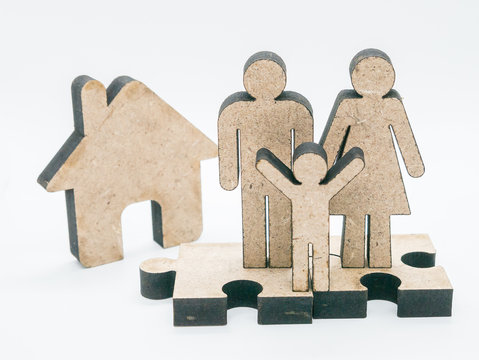 Wood carving family on a white background.