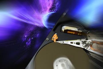 Close Up of Computer open Hard Drive Disk with postproduction effects. background