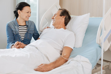 Fototapeta premium Joyful married couple looking at each other