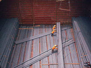 Steel billets are loading in hold of vessel by stevedore at port of  Thailand.