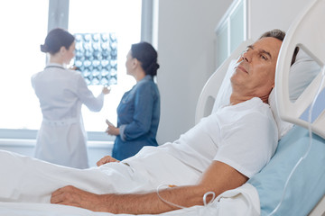 Depressed unhappy man being a patient at the hospital