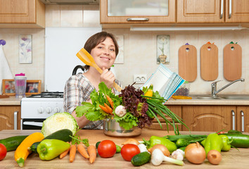 Woman cooking soup from vegetables. Home kitchen interior. Healthy food concept