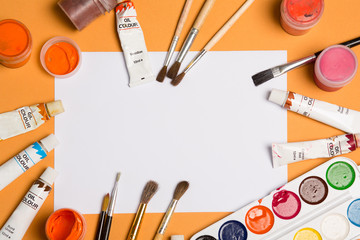 Paints brushes pencils paper colors mock up