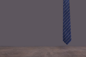 Male blue tie on a gray background