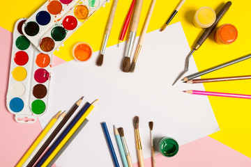 Paints brushes pencils paper colors mock up
