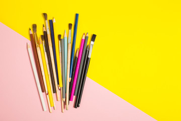 Paints brushes pencils paper colors mock up