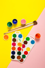 Paints brushes pencils paper colors mock up