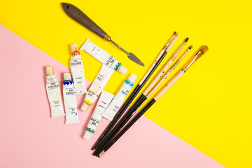 Paints brushes pencils paper colors mock up