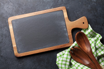 Obraz na płótnie Canvas Cooking utensils on stone table