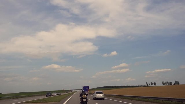 time lapse driving a car on a fast paced motorway in travel.