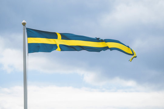 Swedish pennant flag on a flagpole in the wind