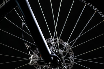 mountain bicycle photography in studio, bike wheel with disc brakes, bike part
