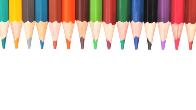 Colored pencils over a white background. Back to school, art and education concept