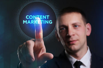 Business, Technology, Internet and network concept. Young businessman working on a virtual screen of the future and sees the inscription: Content marketing