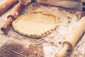 Young children make dough. 