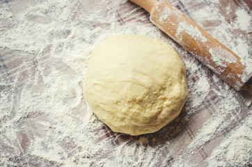 Yeast dough on the table. Cooking baking. Selective focus.  