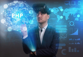 Business, Technology, Internet and network concept. Young businessman working on a virtual screen of the future and sees the inscription: PHP