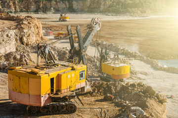 Fototapeta premium Big industrial vehicles, excavators, quarry equipment concept