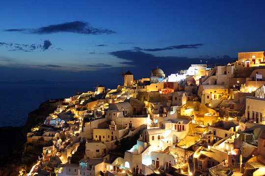 Greek Cityscape of Buildings at Dusk in the town of Oia, Santorini, Greece