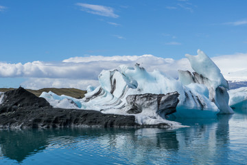 Iceland - Blue and black ice floes on glacier lagoon
