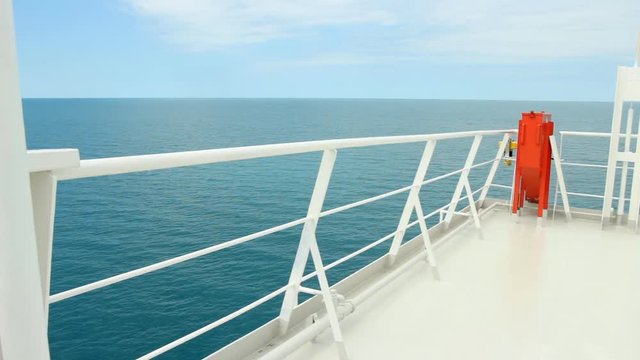 A peaceful and picturesque view from a ferry boat's deck at sea