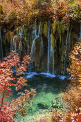 Waterfall in autumn forest at National Park Plitvice Lakes.