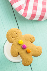 Sweet gingerbread man and glass of milk.