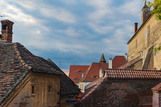 Architectural details and house roofs with attic windows designed in eyes shape in Sibiu city, Romania