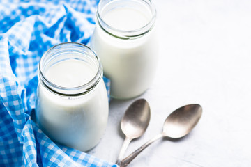 Fresh homemade greek yogurt in glass jars.