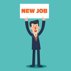 Successful smiling young business man holding a placard with inscription 