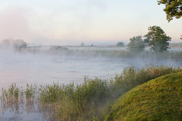 Fototapeta na wymiar Morning mist over the river