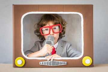 Child playing with cartoon TV