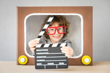 Child playing with cartoon TV