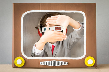 Child playing with cartoon TV