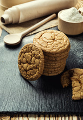 Biscuit sweet cookie background. Domestic stacked butter biscuit pattern concept,close up macro.Homemade cookies on wooden table.Cereal biscuits with the sesame,peanuts,sunflower and amaranth.