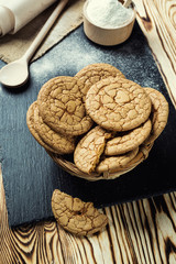 Biscuit sweet cookie background. Domestic stacked butter biscuit pattern concept,close up macro.Homemade cookies on wooden table.Cereal biscuits with the sesame,peanuts,sunflower and amaranth.