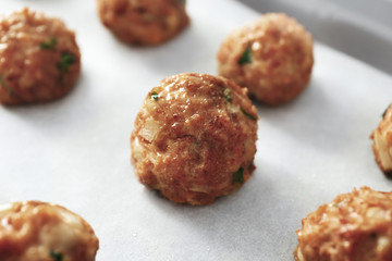 Closeup view of delicious turkey meatballs on light background
