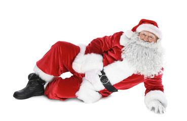 Happy authentic Santa Claus lying against white background