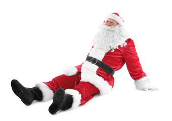 Happy authentic Santa Claus sitting against white background