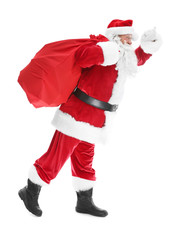Authentic Santa Claus with big gift bag on white background