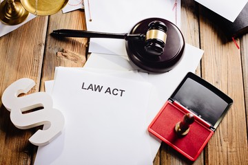 Law act on old wooden desk in library