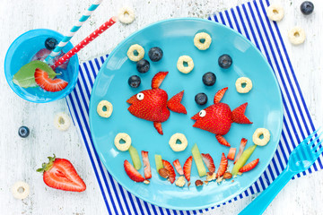 Fun with food - berry fruit fish on plate