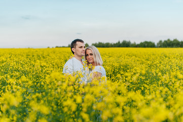 Young couple in a yellow field