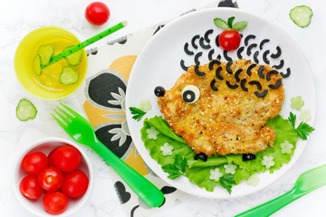 Food art idea for kids lunch - chicken schnitzel with vegetables shaped hedgehog