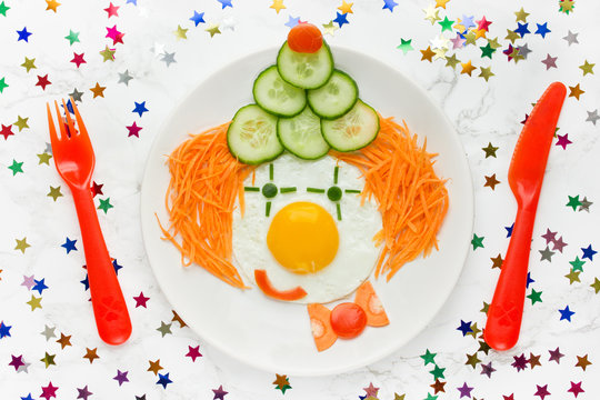 Fried egg vegetables clown face for kids
