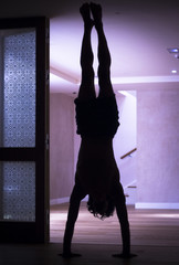 Fototapeta na wymiar Man yoga handstand