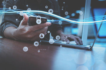 cyber security internet and networking concept.Businessman hand working with VR screen padlock icon...